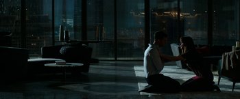 Movie still from “Fifty Shades Darker” (2017), directed by James Foley – A man sitting on the ground in a dark room; Wide shot, High angle