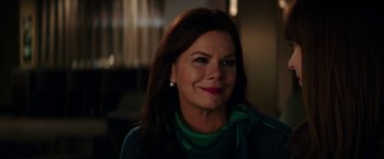 Movie still from “Fifty Shades Darker” (2017), directed by James Foley – A person smiling for a picture; Close Up shot, Over the shoulder angle