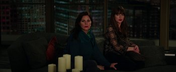 Movie still from “Fifty Shades Darker” (2017), directed by James Foley – Two women sitting next to each other on a couch; Medium shot, High angle