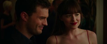 Movie still from “Fifty Shades Darker” (2017), directed by James Foley – A man and a woman looking at one another; Close Up shot, Over the shoulder angle