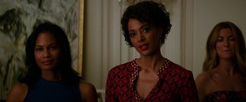 Movie still from “Fifty Shades Darker” (2017), directed by James Foley – A woman in a red and black shirt; Close Up shot, Over the shoulder angle