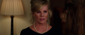 Movie still from “Fifty Shades Darker” (2017), directed by James Foley – A person wearing a pearl necklace; Close Up shot, Over the shoulder angle