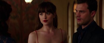 Movie still from “Fifty Shades Darker” (2017), directed by James Foley – A person wearing a red dress; Close Up shot, Over the shoulder angle