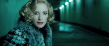 Movie still from “Filth” (2013), directed by Jon S. Baird – A woman with blonde hair wearing a fur coat; Close Up shot, Low angle