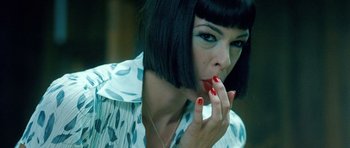 Movie still from “Filth” (2013), directed by Jon S. Baird – A person with short black hair; Close Up shot, Low angle