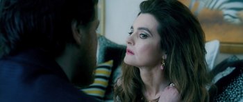 Movie still from “Filth” (2013), directed by Jon S. Baird – A man and a woman looking at one another; Close Up shot, Over the shoulder angle