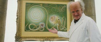 Movie still from “Filth” (2013), directed by Jon S. Baird – An older man holding his hand out in front of a painting; Medium shot, Overhead angle