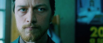 Movie still from “Filth” (2013), directed by Jon S. Baird – A man with a beard; Close Up shot, Low angle