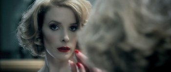 Movie still from “Filth” (2013), directed by Jon S. Baird – A person's face in a mirror; Extreme Close Up shot, Over the shoulder angle