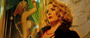 Movie still from “Filth” (2013), directed by Jon S. Baird – A person wearing a necklace; Close Up shot, Low angle