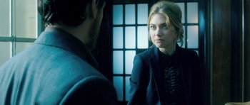 Movie still from “Filth” (2013), directed by Jon S. Baird – A man and a woman looking at one another in a mirror; Close Up shot, Over the shoulder angle