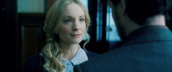 Movie still from “Filth” (2013), directed by Jon S. Baird – A woman with long blonde hair looking at a man; Close Up shot, Over the shoulder angle