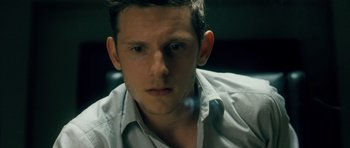 Movie still from “Filth” (2013), directed by Jon S. Baird – A person wearing a shirt and tie; Close Up shot, Low angle