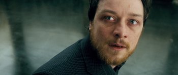 Movie still from “Filth” (2013), directed by Jon S. Baird – A person with a beard; Close Up shot, High angle
