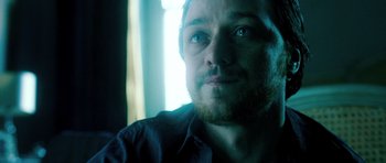 Movie still from “Filth” (2013), directed by Jon S. Baird – A person with a beard; Close Up shot, Over the shoulder angle