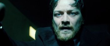 Movie still from “Filth” (2013), directed by Jon S. Baird – A person with a beard; Close Up shot, Low angle