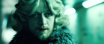 Movie still from “Filth” (2013), directed by Jon S. Baird – A person wearing a wig; Close Up shot, Low angle