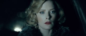 Movie still from “Filth” (2013), directed by Jon S. Baird – A person wearing a fur coat; Close Up shot, Low angle