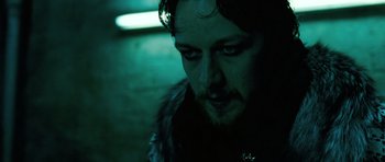 Movie still from “Filth” (2013), directed by Jon S. Baird – A person wearing a jacket; Close Up shot, Low angle