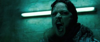 Movie still from “Filth” (2013), directed by Jon S. Baird – A person with his mouth wide open; Close Up shot, Low angle