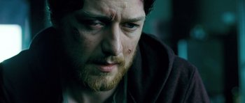 Movie still from “Filth” (2013), directed by Jon S. Baird – A person with a beard; Close Up shot, High angle