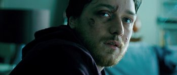 Movie still from “Filth” (2013), directed by Jon S. Baird – A person with a beard; Close Up shot, Low angle