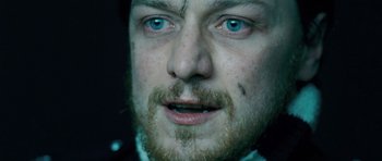 Movie still from “Filth” (2013), directed by Jon S. Baird – A person with a beard; Extreme Close Up shot, Overhead angle