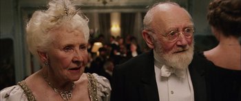 Movie still from “Finding Neverland” (2004), directed by Marc Forster – An older man and woman in formal attire; Close Up shot, Low angle