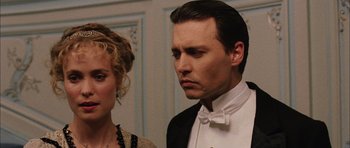 Movie still from “Finding Neverland” (2004), directed by Marc Forster – A man and a woman standing next to each other; Close Up shot, Low angle