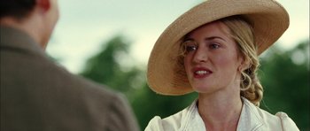 Movie still from “Finding Neverland” (2004), directed by Marc Forster – A person wearing a straw hat; Close Up shot, Over the shoulder angle