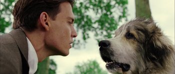 Movie still from “Finding Neverland” (2004), directed by Marc Forster – A person and a dog face to face; Close Up shot, Low angle