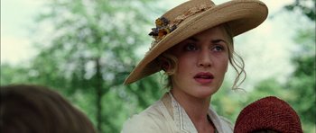 Movie still from “Finding Neverland” (2004), directed by Marc Forster – A person wearing a straw hat; Close Up shot, Low angle