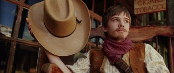 Movie still from “Finding Neverland” (2004), directed by Marc Forster – A man with a cowboy hat and a mustache; Close Up shot, Low angle
