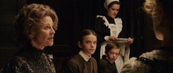 Movie still from “Finding Neverland” (2004), directed by Marc Forster – A group of people dressed up in costumes; Close Up shot, Low angle