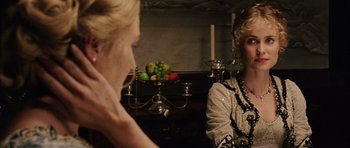 Movie still from “Finding Neverland” (2004), directed by Marc Forster – Two women are talking in front of a mirror with fruit on the table; Close Up shot, Over the shoulder angle