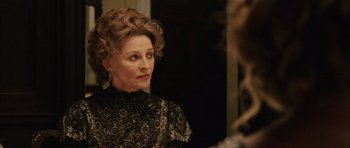 Movie still from “Finding Neverland” (2004), directed by Marc Forster – An older woman looking at herself in the mirror; Close Up shot, Over the shoulder angle