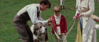 Movie still from “Finding Neverland” (2004), directed by Marc Forster – A man and a boy with a dog in a field; Medium shot, Over the shoulder angle