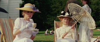 Movie still from “Finding Neverland” (2004), directed by Marc Forster – Two women sitting on a chair in a park; Medium shot, Low angle