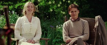 Movie still from “Finding Neverland” (2004), directed by Marc Forster – Two people sitting on a chair in a garden; Medium shot, Low angle