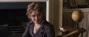 Movie still from “Finding Neverland” (2004), directed by Marc Forster – A person sitting in a room; Close Up shot, Over the shoulder angle