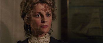 Movie still from “Finding Neverland” (2004), directed by Marc Forster – An older woman wearing a white lace collar; Close Up shot, Over the shoulder angle