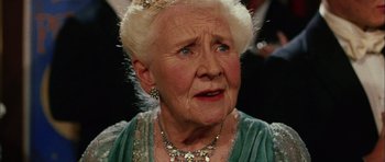 Movie still from “Finding Neverland” (2004), directed by Marc Forster – An old woman with a very large head wearing a necklace; Close Up shot, Low angle