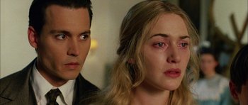 Movie still from “Finding Neverland” (2004), directed by Marc Forster – A man and a woman looking at each other; Close Up shot, Over the shoulder angle