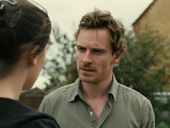Movie still from “Fish Tank” (2009), directed by Andrea Arnold – A man and a woman talking to each other outside; Close Up shot, Over the shoulder angle