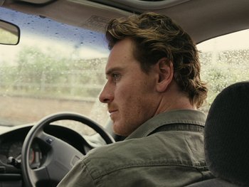Movie still from “Fish Tank” (2009), directed by Andrea Arnold – A person in a car; Close Up shot, Over the shoulder angle