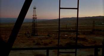 Movie still from “Five Easy Pieces” (1970), directed by Bob Rafelson – An oil rig in the middle of a desert; Extreme Wide shot, High angle