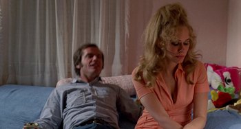 Movie still from “Five Easy Pieces” (1970), directed by Bob Rafelson – A man and a woman sitting on a couch in a living room; Medium shot, Low angle