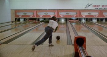 Movie still from “Five Easy Pieces” (1970), directed by Bob Rafelson – A woman is bowling in a bowling alley; Wide shot, High angle