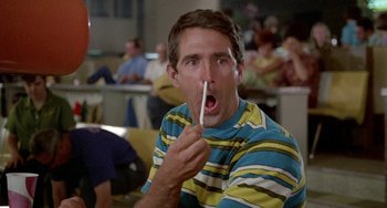 Movie still from “Five Easy Pieces” (1970), directed by Bob Rafelson – A man holding a tooth brush up to his mouth; Close Up shot, Low angle