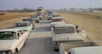Movie still from “Five Easy Pieces” (1970), directed by Bob Rafelson – A man standing in the middle of a road; Wide shot, High angle